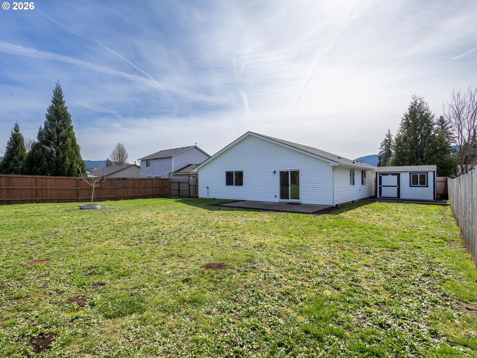 304 East Wilson Street Yacolt, WA 98675 - Photo 27 of 29 a aerial view of a house next to a yard