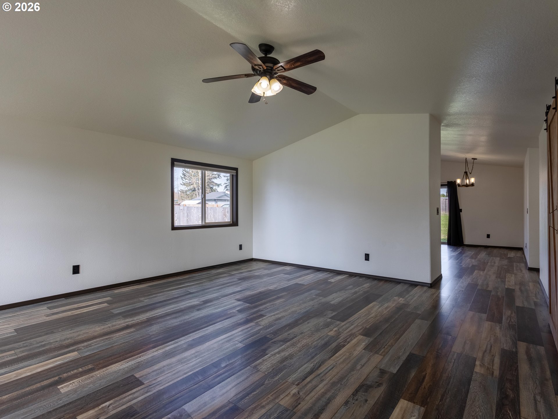 304 East Wilson Street Yacolt, WA 98675 - Photo 4 of 29 a view of a big room with wooden floor and windows