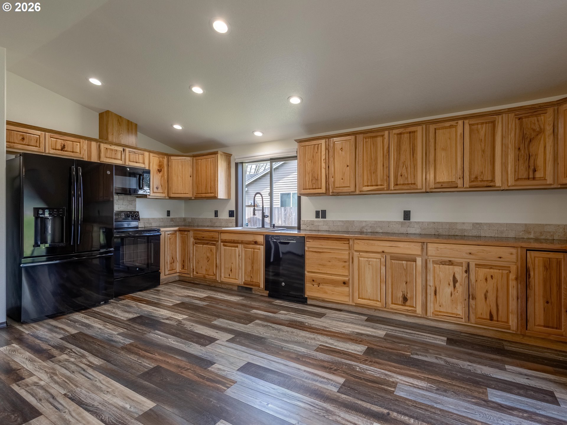 304 East Wilson Street Yacolt, WA 98675 - Photo 7 of 29 a kitchen with stainless steel appliances granite countertop a refrigerator sink and cabinets