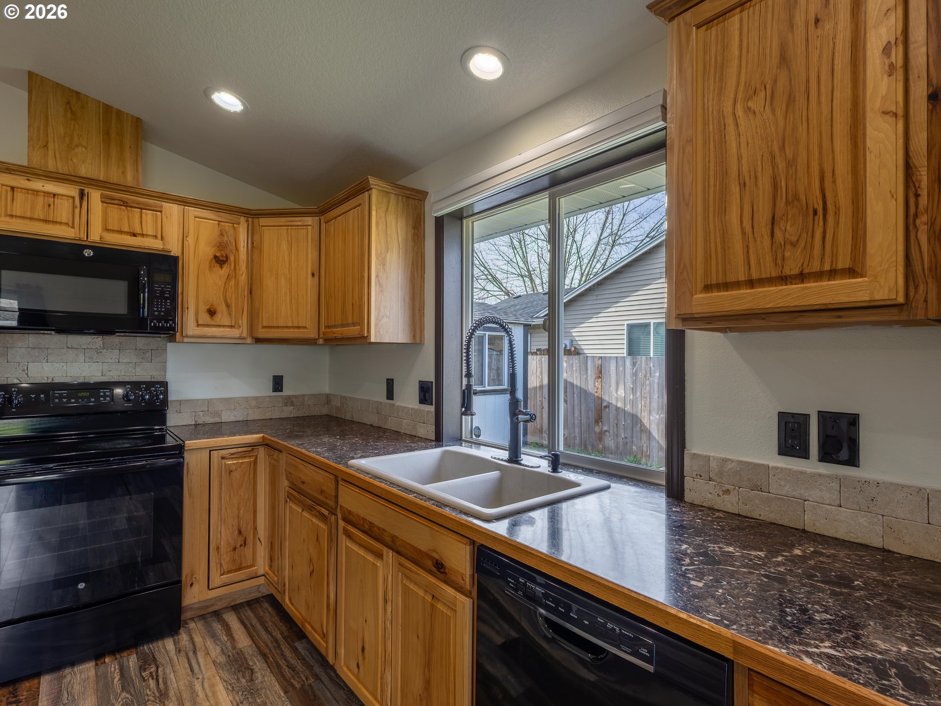 304 East Wilson Street Yacolt, WA 98675 - Photo 8 of 29 a kitchen with granite countertop stainless steel appliances a sink stove top oven and cabinets