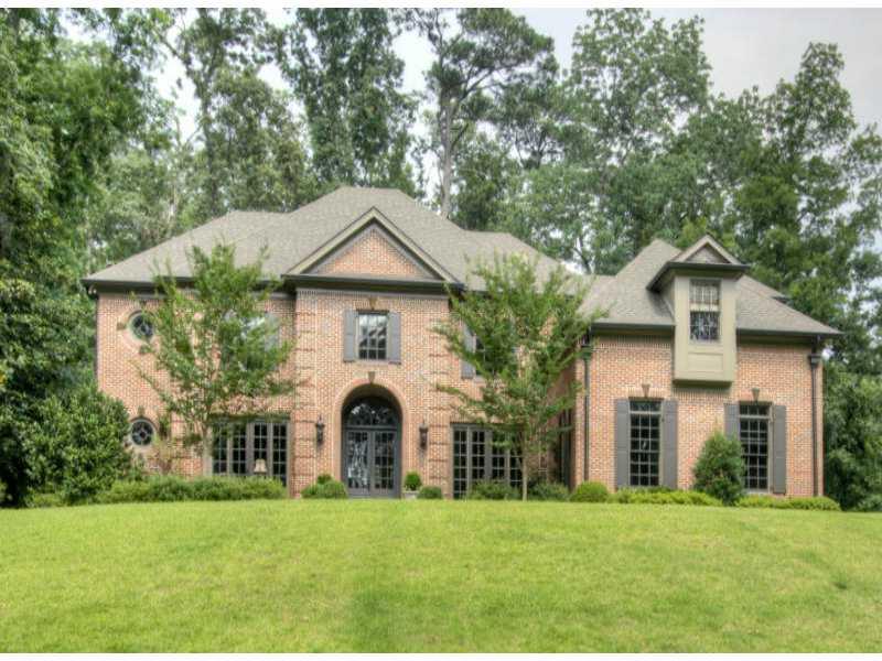 3665 Randall Hall Road Northwest Atlanta, GA 30327 - Photo 1 of 1 a front view of a house with a garden