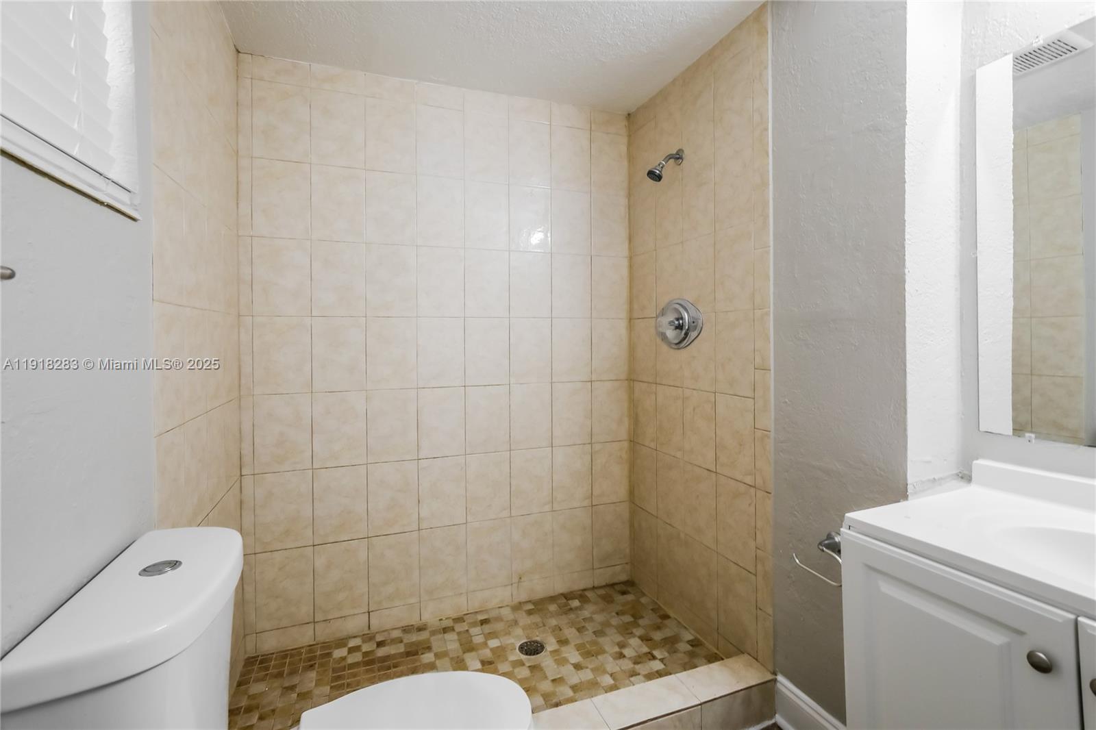 6212 Northwest 15th Court Margate, FL 33063 - Photo 11 of 16 a bathroom with a shower and toilet