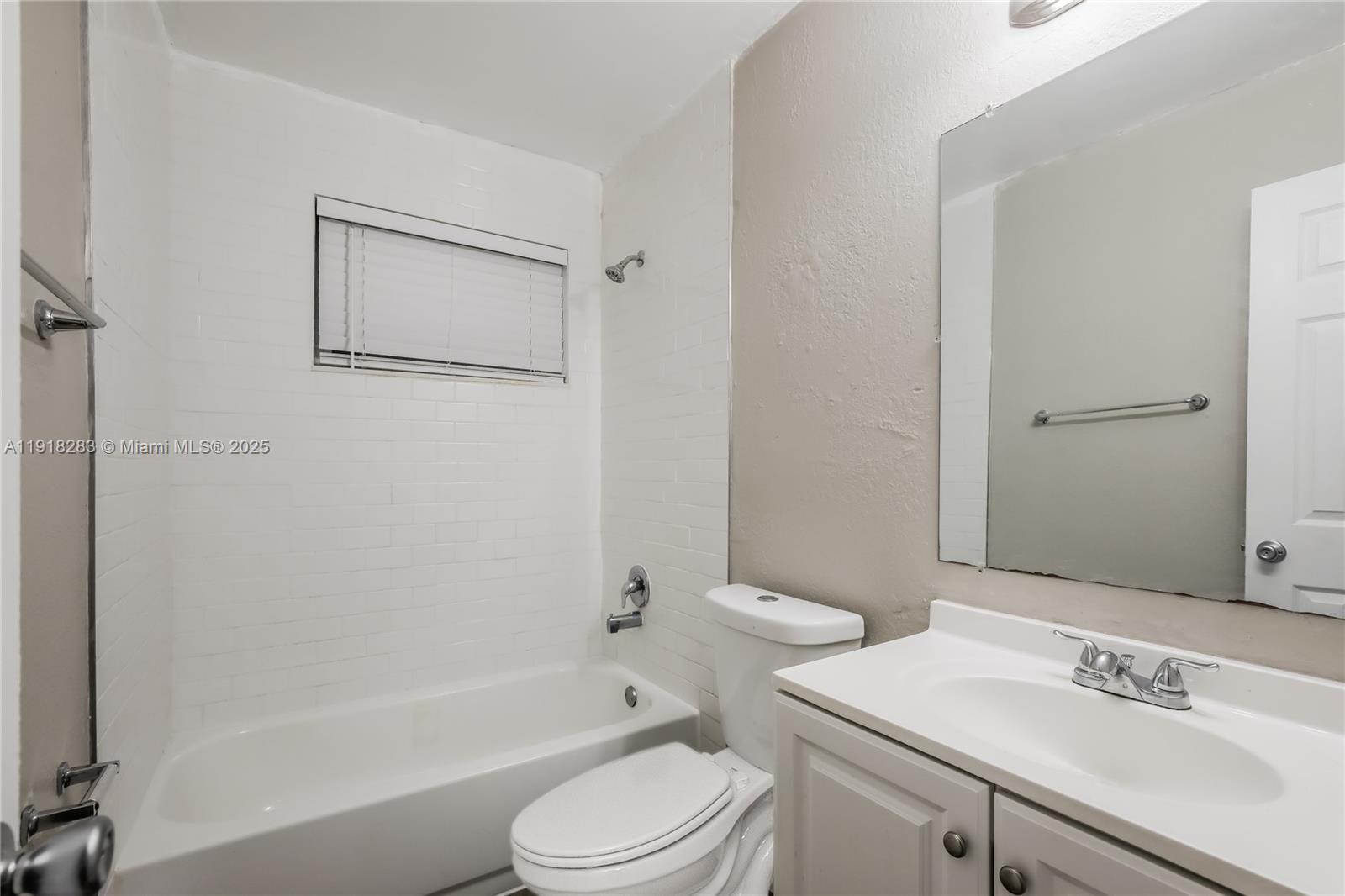 6212 Northwest 15th Court Margate, FL 33063 - Photo 14 of 16 a bathroom with a sink a toilet and shower