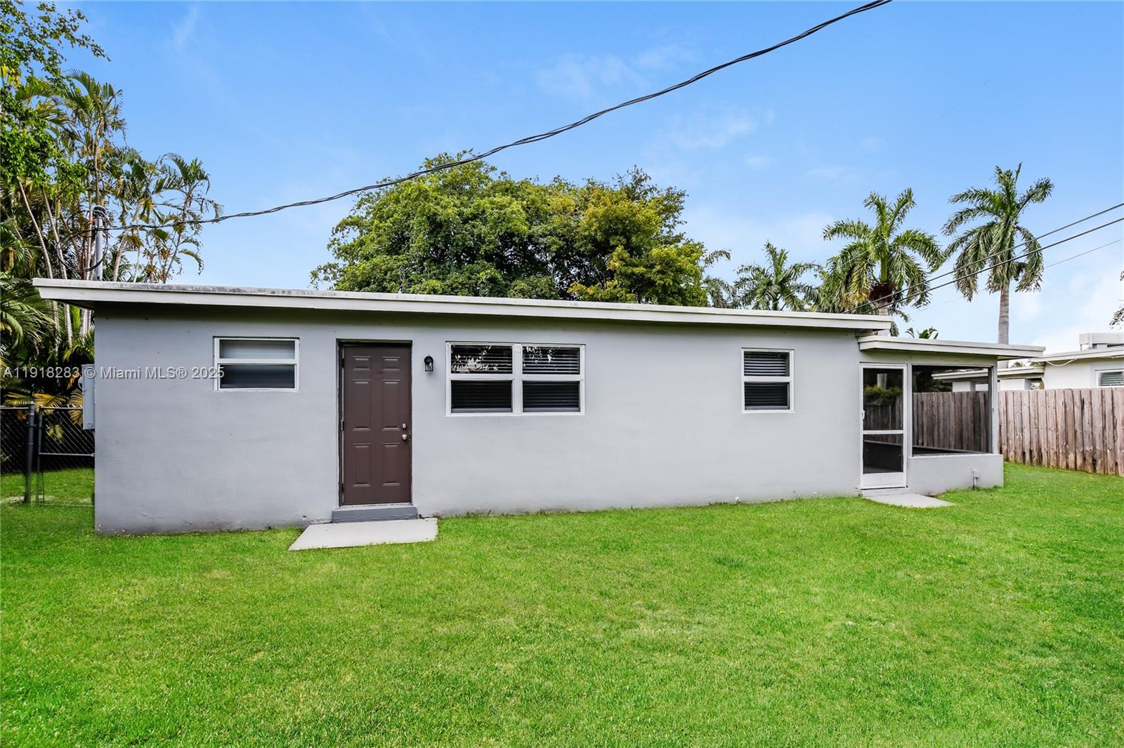 6212 Northwest 15th Court Margate, FL 33063 - Photo 16 of 16 a front view of house with yard and trees in the background