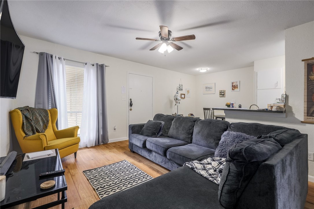 2207 Leon Street, Unit 203 Austin, TX 78705 - Photo 1 of 1 a living room with furniture and a rug