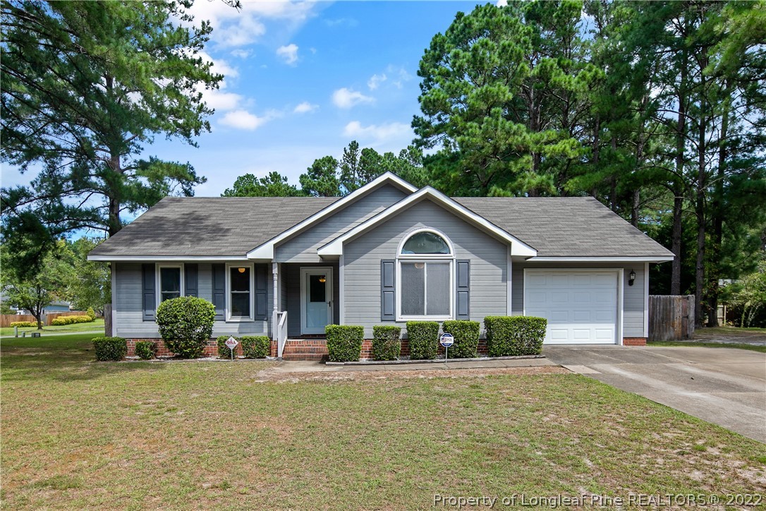 203 Cobblestone Court Raeford, NC 28376 - Photo 1 of 46 a front view of a house with garden