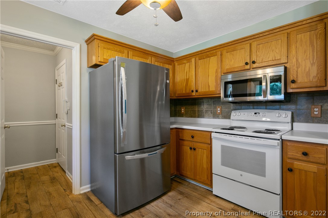203 Cobblestone Court Raeford, NC 28376 - Photo 15 of 46 a kitchen with a refrigerator sink and microwave