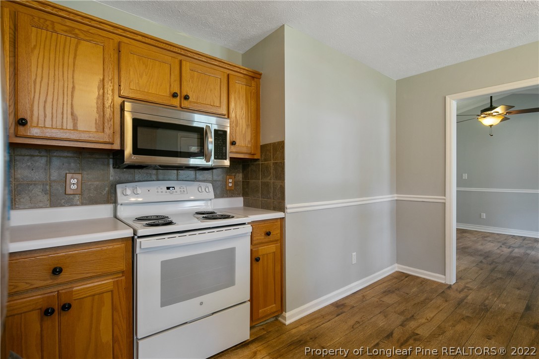 203 Cobblestone Court Raeford, NC 28376 - Photo 17 of 46 a kitchen with a stove microwave and sink