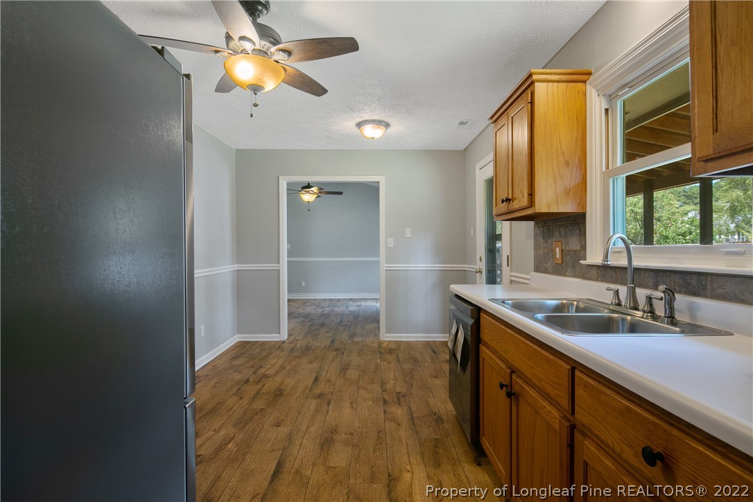203 Cobblestone Court Raeford, NC 28376 - Photo 18 of 46 a kitchen with a sink appliances and a cabinets
