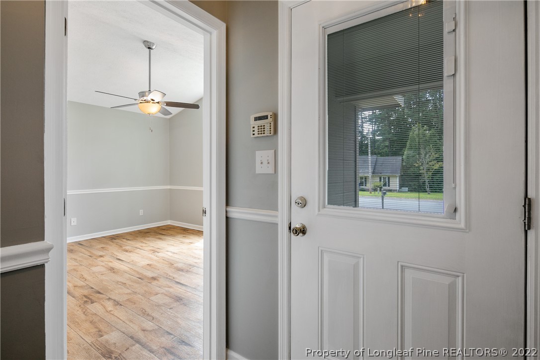 203 Cobblestone Court Raeford, NC 28376 - Photo 20 of 46 a view of a livingroom with a ceiling fan & window