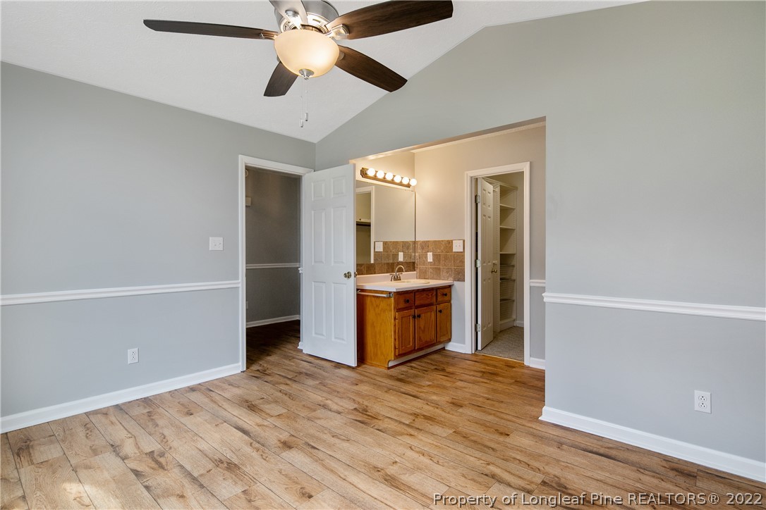 203 Cobblestone Court Raeford, NC 28376 - Photo 23 of 46 a kitchen with a refrigerator and a stove top oven