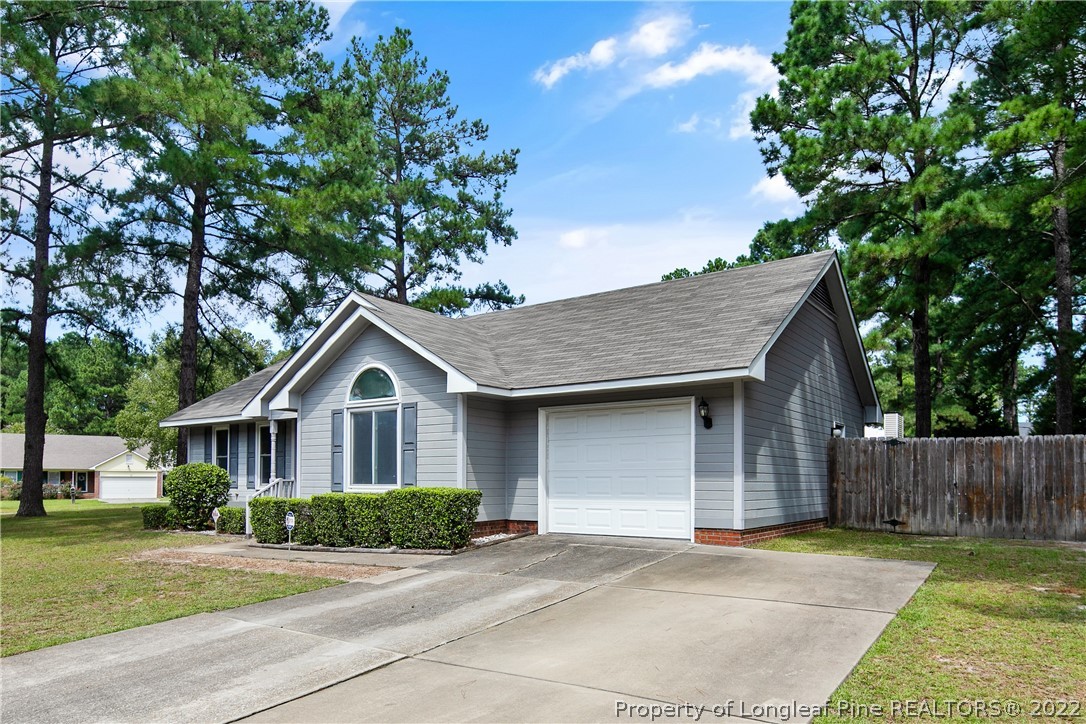 203 Cobblestone Court Raeford, NC 28376 - Photo 3 of 46 a front view of a house with a garden