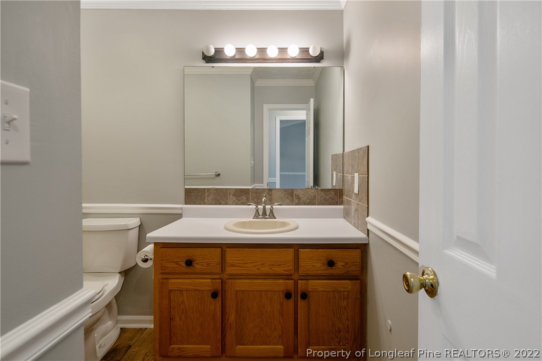 203 Cobblestone Court Raeford, NC 28376 - Photo 36 of 46 a bathroom with a sink and a mirror