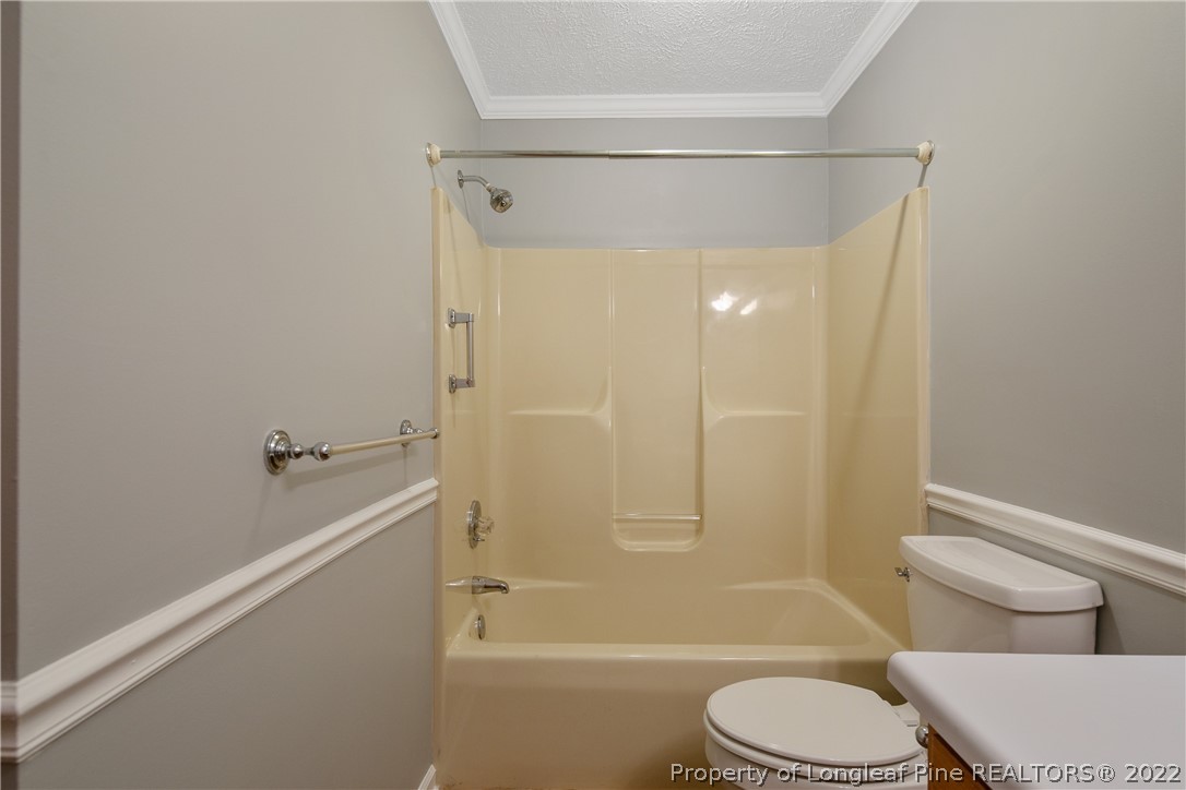 203 Cobblestone Court Raeford, NC 28376 - Photo 38 of 46 a bathroom with a toilet and a shower