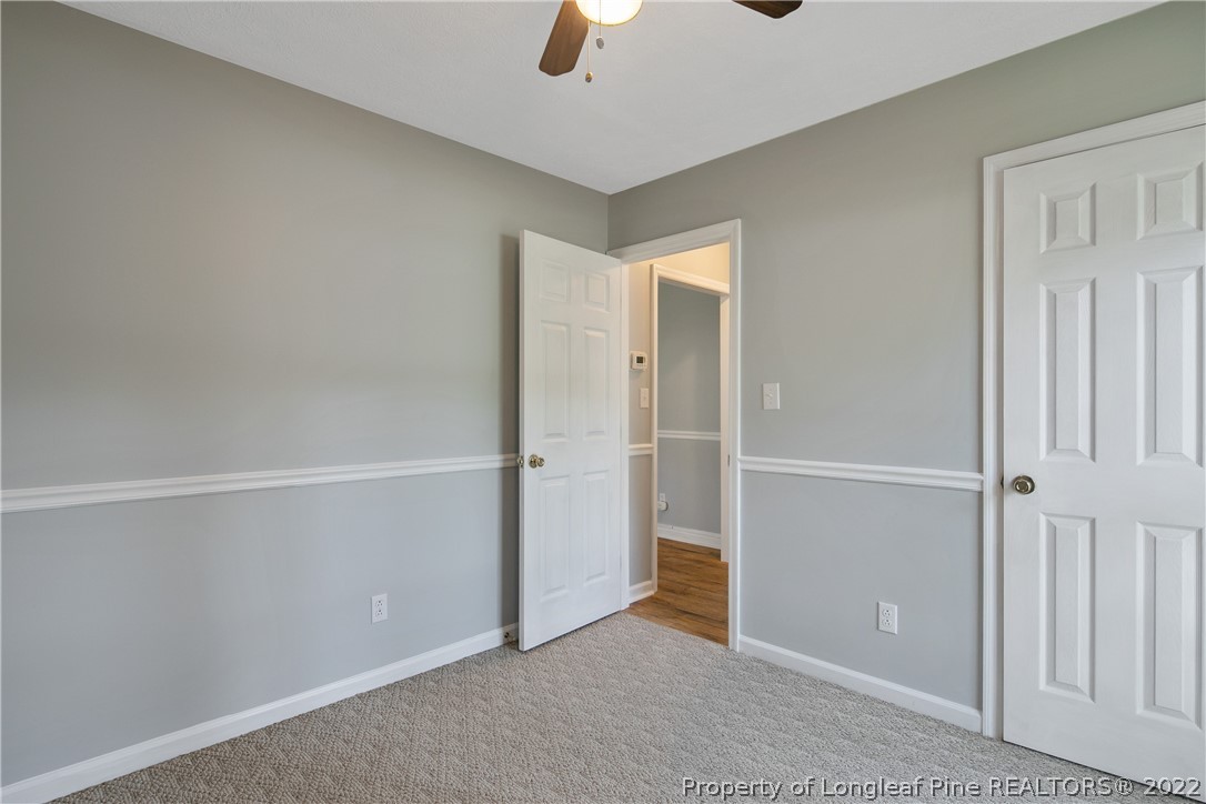 203 Cobblestone Court Raeford, NC 28376 - Photo 41 of 46 an empty room with ceiling fan