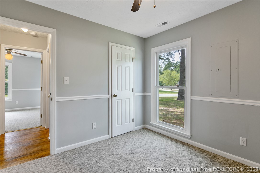 203 Cobblestone Court Raeford, NC 28376 - Photo 42 of 46 a view of an empty room with wooden floor and a window