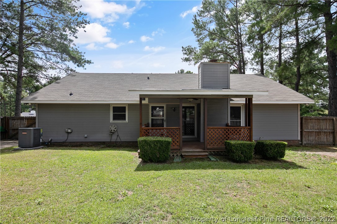 203 Cobblestone Court Raeford, NC 28376 - Photo 44 of 46 a front view of a house with a garden and plants