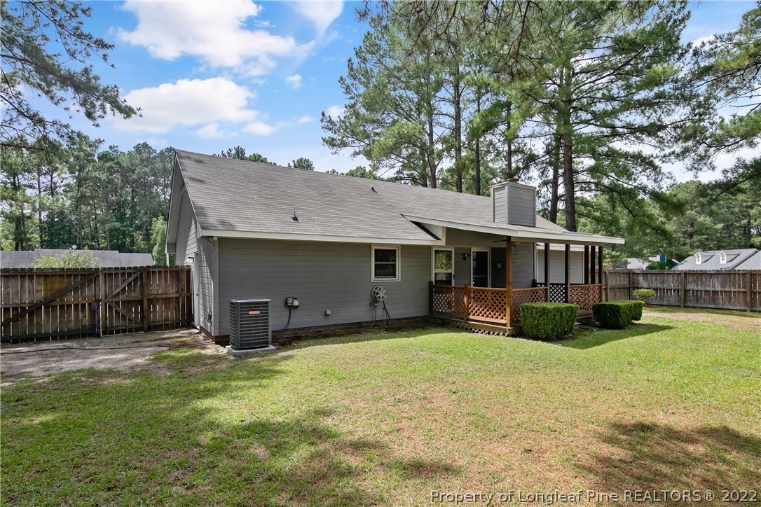 203 Cobblestone Court Raeford, NC 28376 - Photo 45 of 46 a view of a house with a yard and sitting area