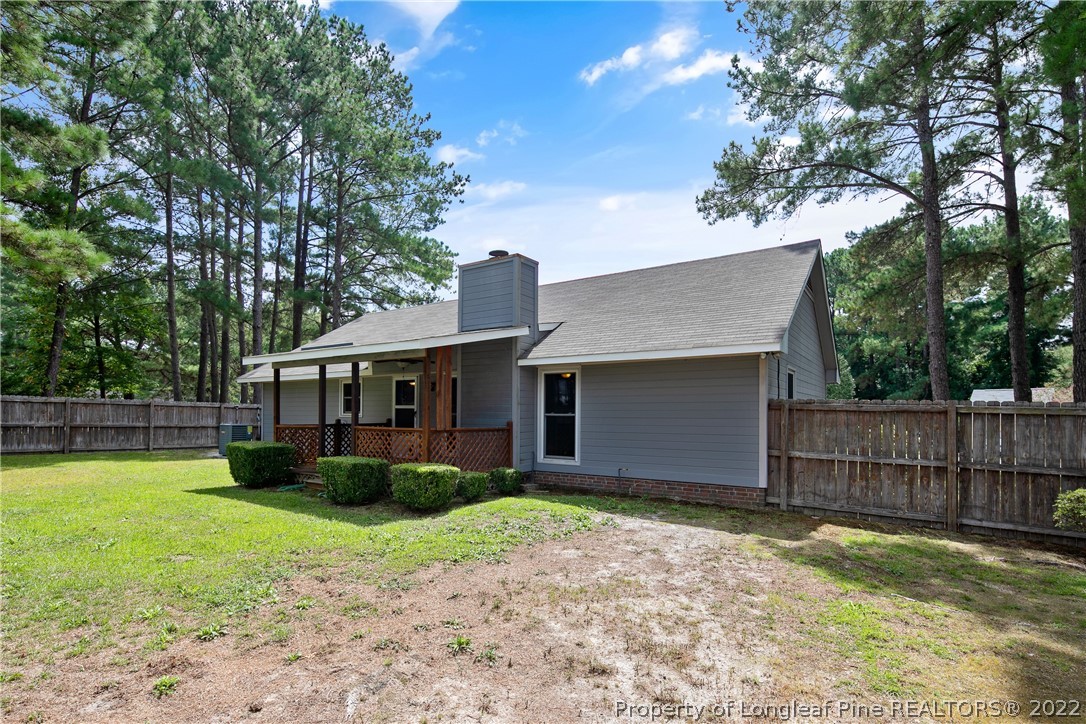 203 Cobblestone Court Raeford, NC 28376 - Photo 46 of 46 a view of a house with backyard and a tree