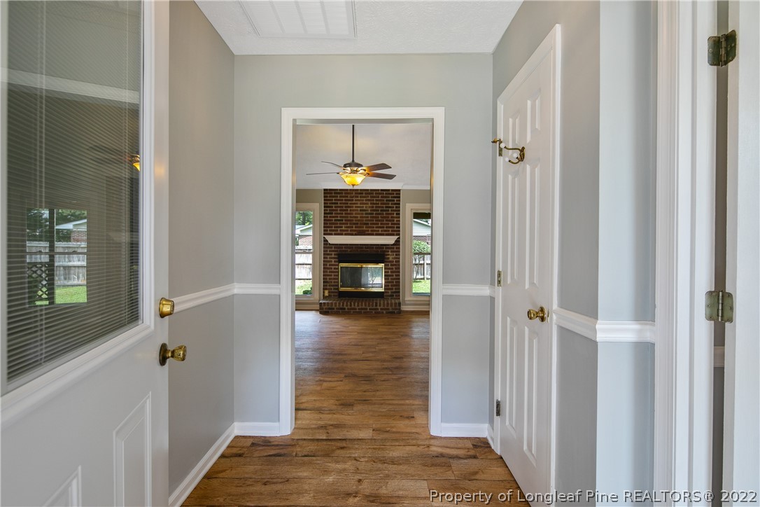 203 Cobblestone Court Raeford, NC 28376 - Photo 5 of 46 a view of a hallway view with wooden floor and staircase