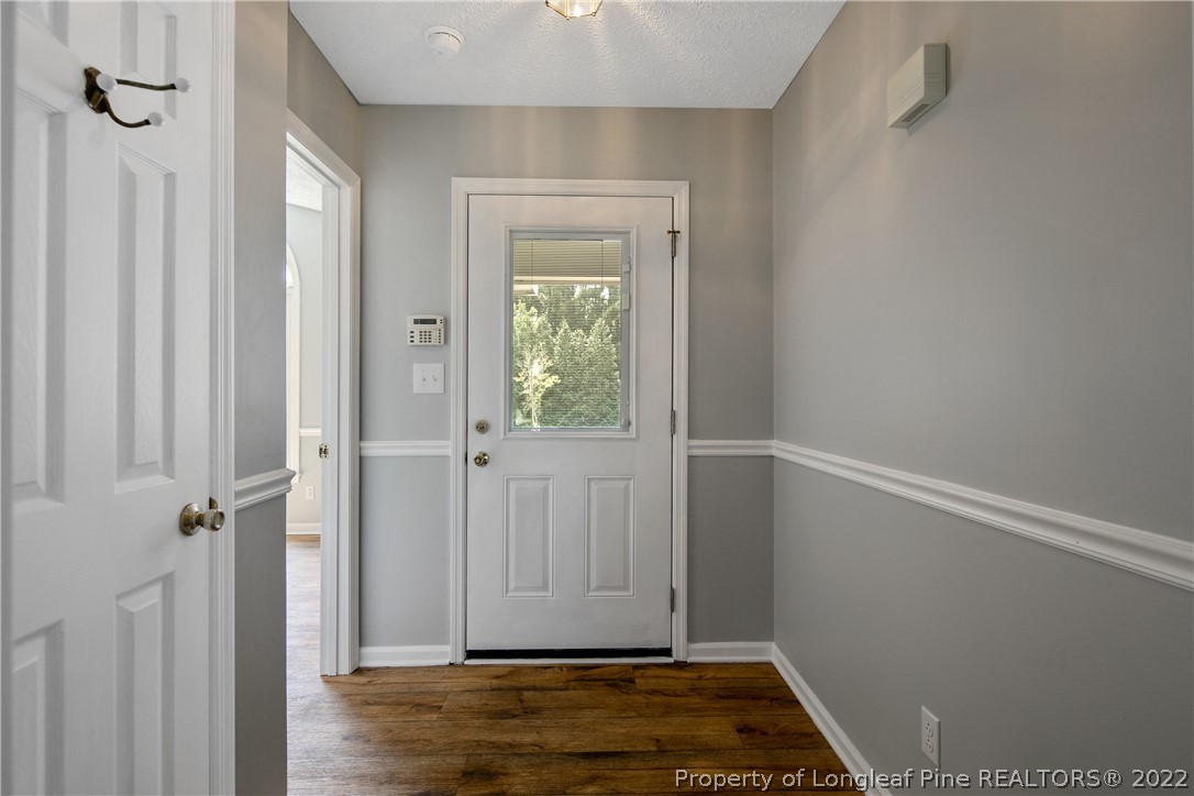 203 Cobblestone Court Raeford, NC 28376 - Photo 6 of 46 a view of room with hardwood floor and a window