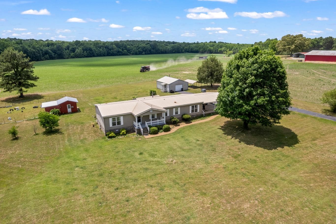 6439 Cedar Grove Road Big Sandy, TN 38221 - Photo 33 of 38 a view of a lake with lawn chairs and potted plants