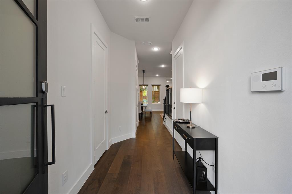 4113 Entrada Way Dallas, TX 75219 - Photo 3 of 32 Long entryway to the kitchen and living area.