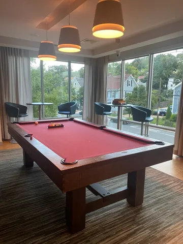 a dining room with a table and chairs
