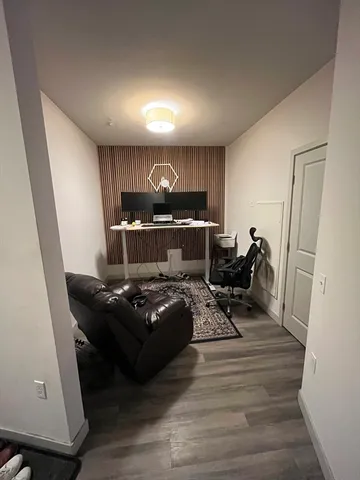 a bathroom with a sink vanity and toilet