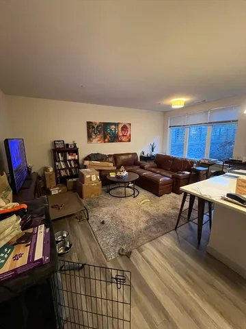 a view of parking garage with cars parked