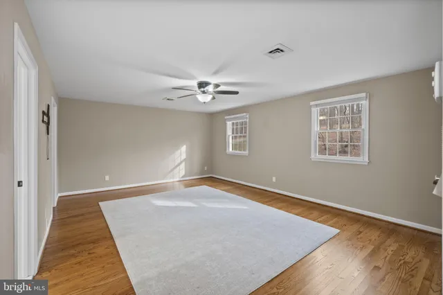 a view of an empty room with windows