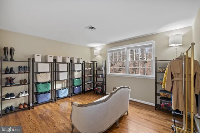 a living room with lots of furniture and a book shelf