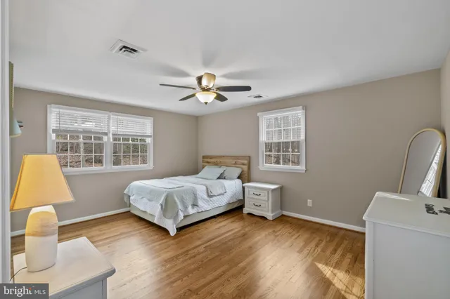 a spacious bedroom with a bed and a couch