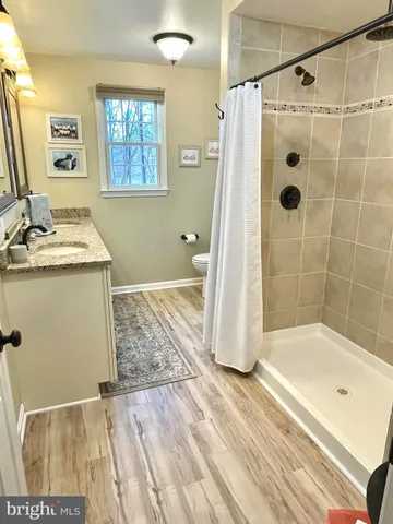 a bathroom with a sink a bath tub and a shower