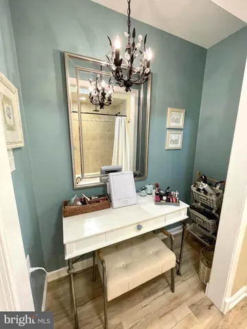 a room with a table chairs and entryway