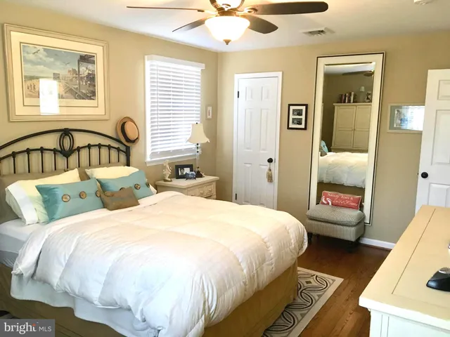 a bedroom with double bed and a window