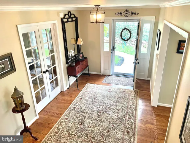 a view of an entryway with wooden floor