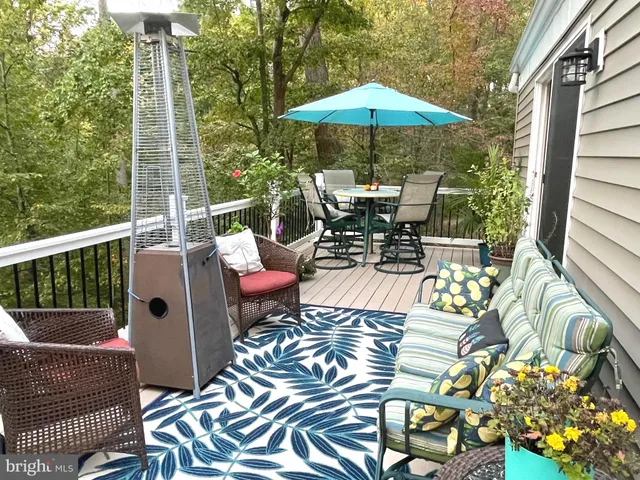 a view of a chairs and table in the balcony