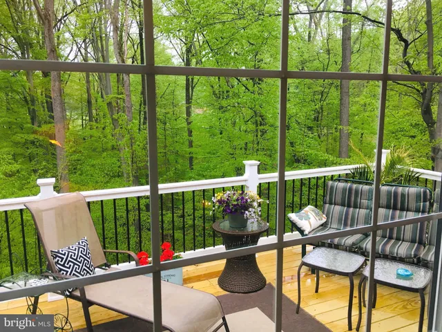 a view of a balcony with chairs