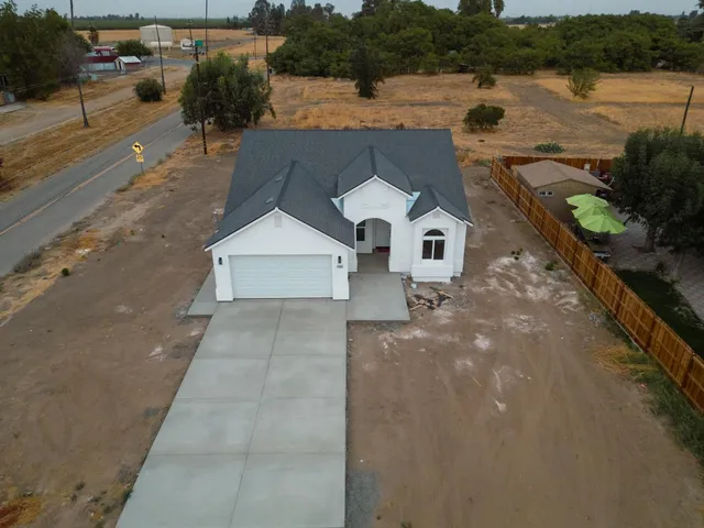 an aerial view of a house with lake view