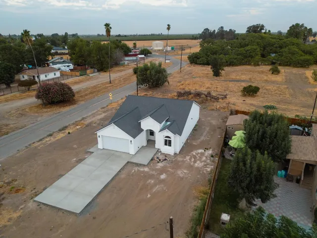 an aerial view of a house with lake view
