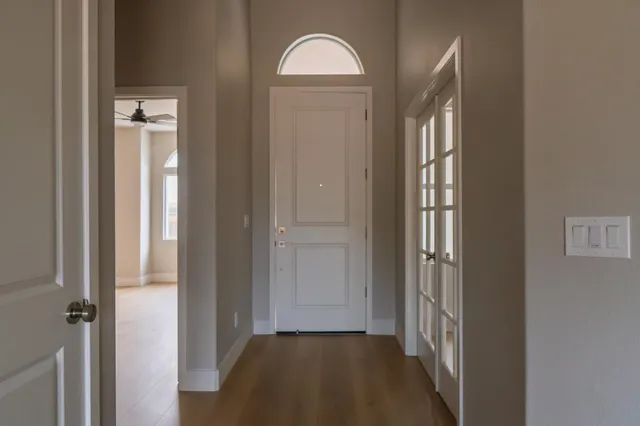 a view of entryway with wooden floor
