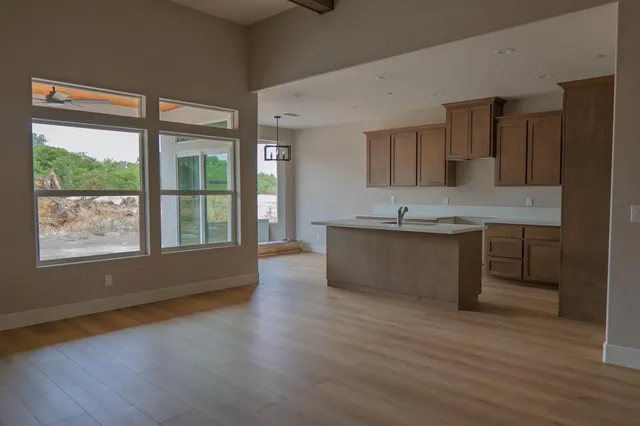 a view of kitchen with cabinets and wooden floor