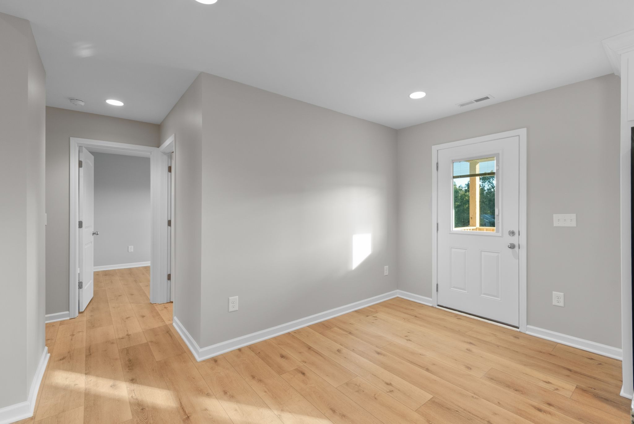 81 Dukes Park Road Summertown, TN 38483 - Photo 11 of 32 wooden floor in an empty room with a window