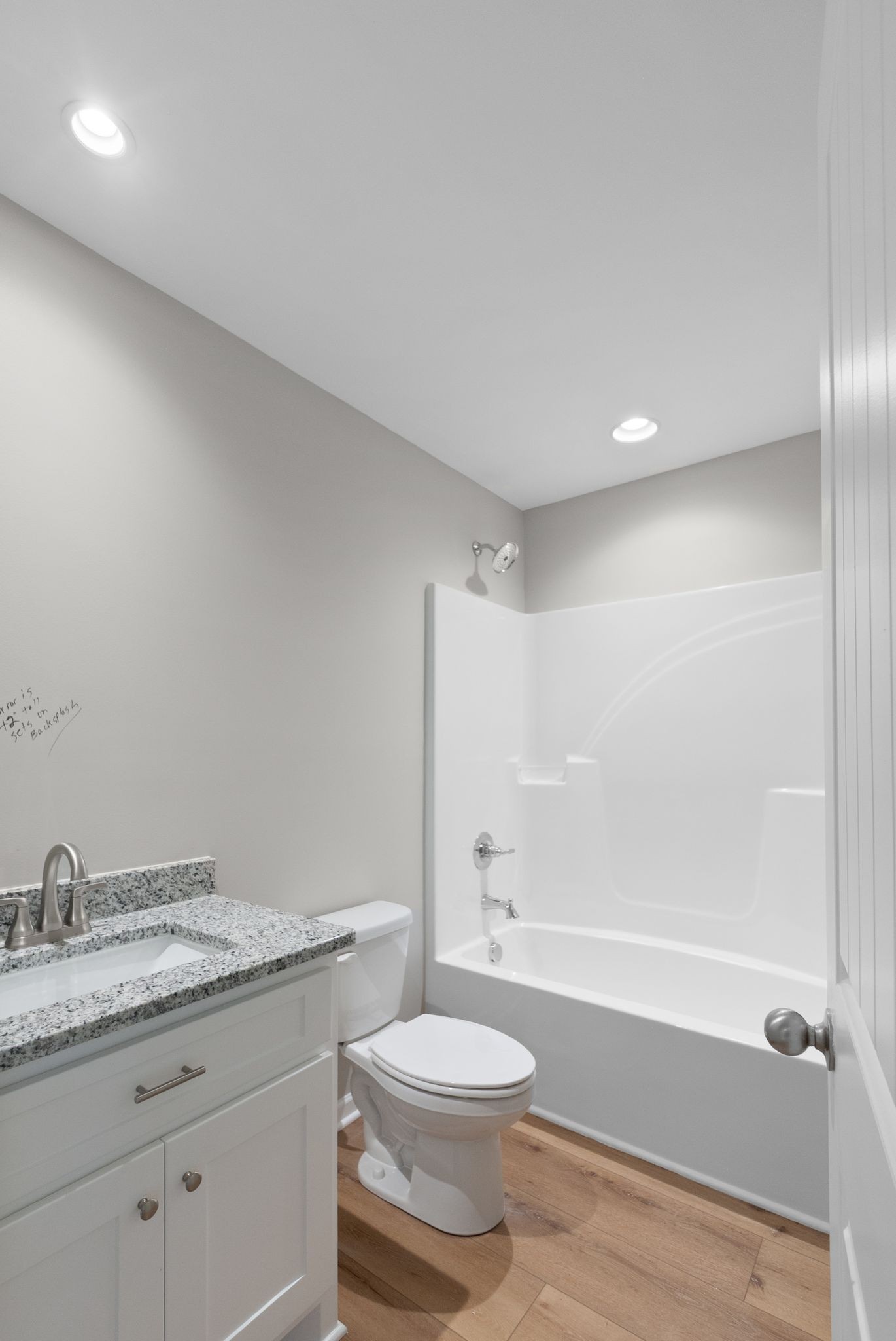 81 Dukes Park Road Summertown, TN 38483 - Photo 21 of 32 a bathroom with a granite countertop toilet a sink and a bathtub
