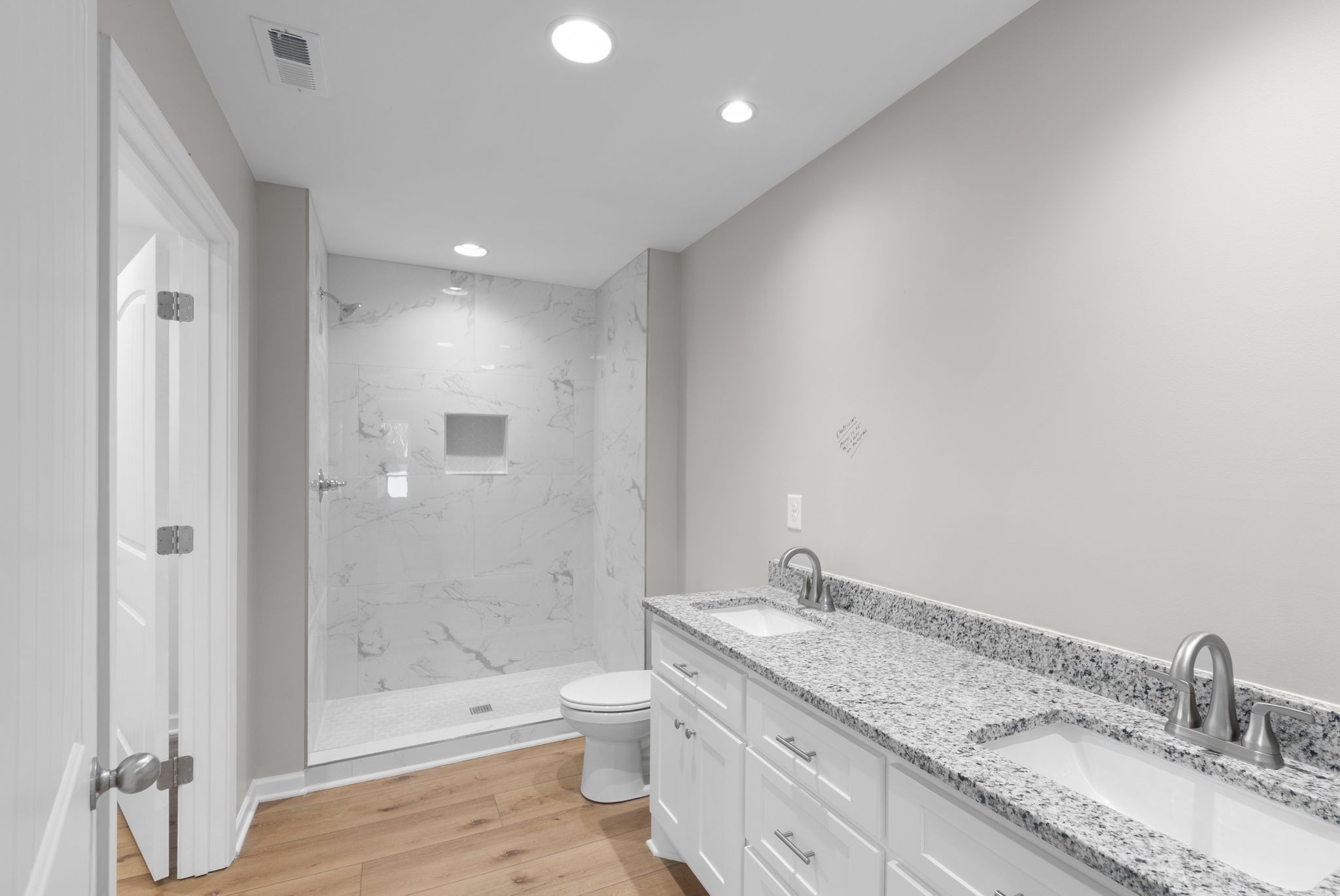 81 Dukes Park Road Summertown, TN 38483 - Photo 24 of 32 a bathroom with a granite countertop sink a toilet and shower