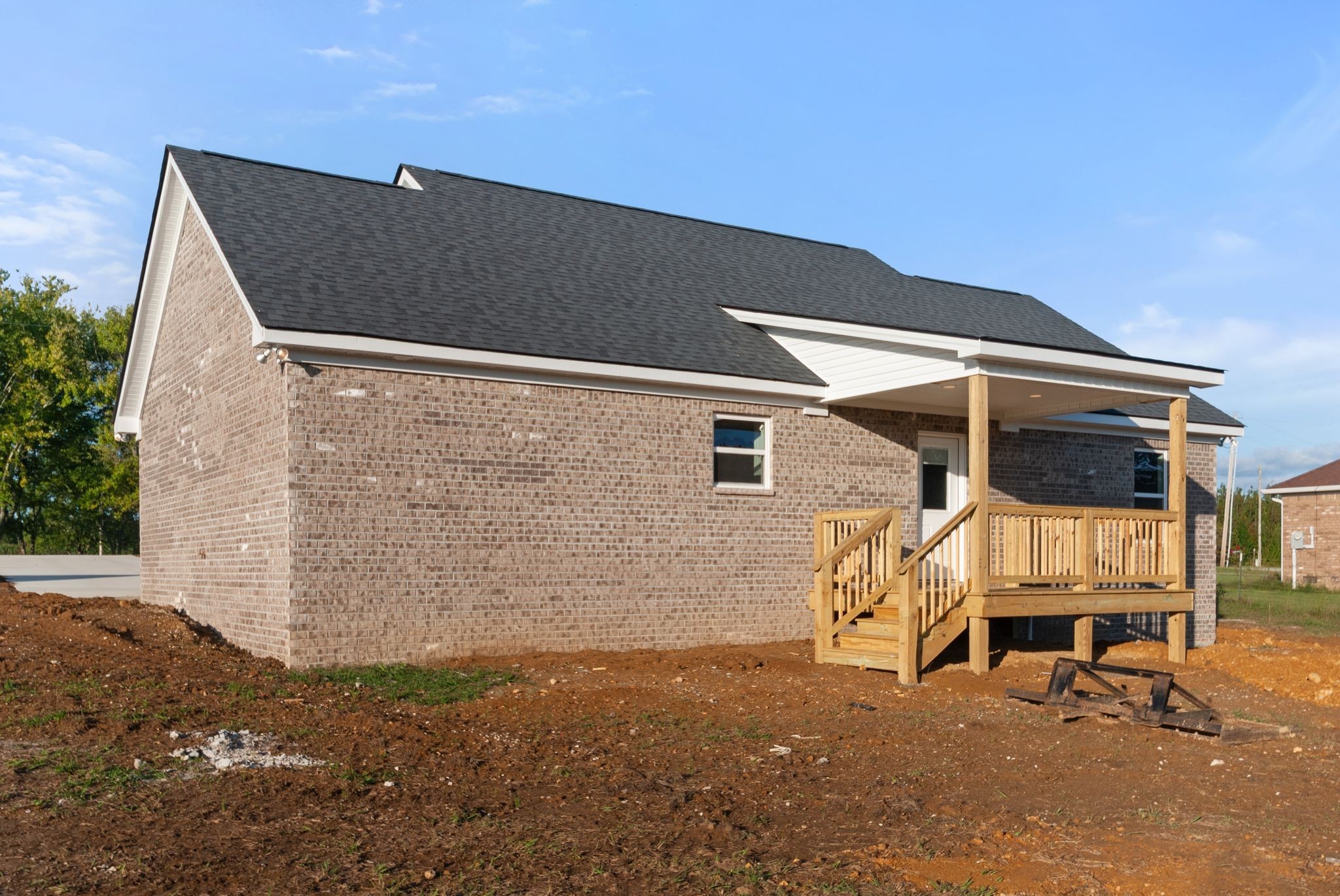 81 Dukes Park Road Summertown, TN 38483 - Photo 31 of 32 a backyard of a house with table and chairs