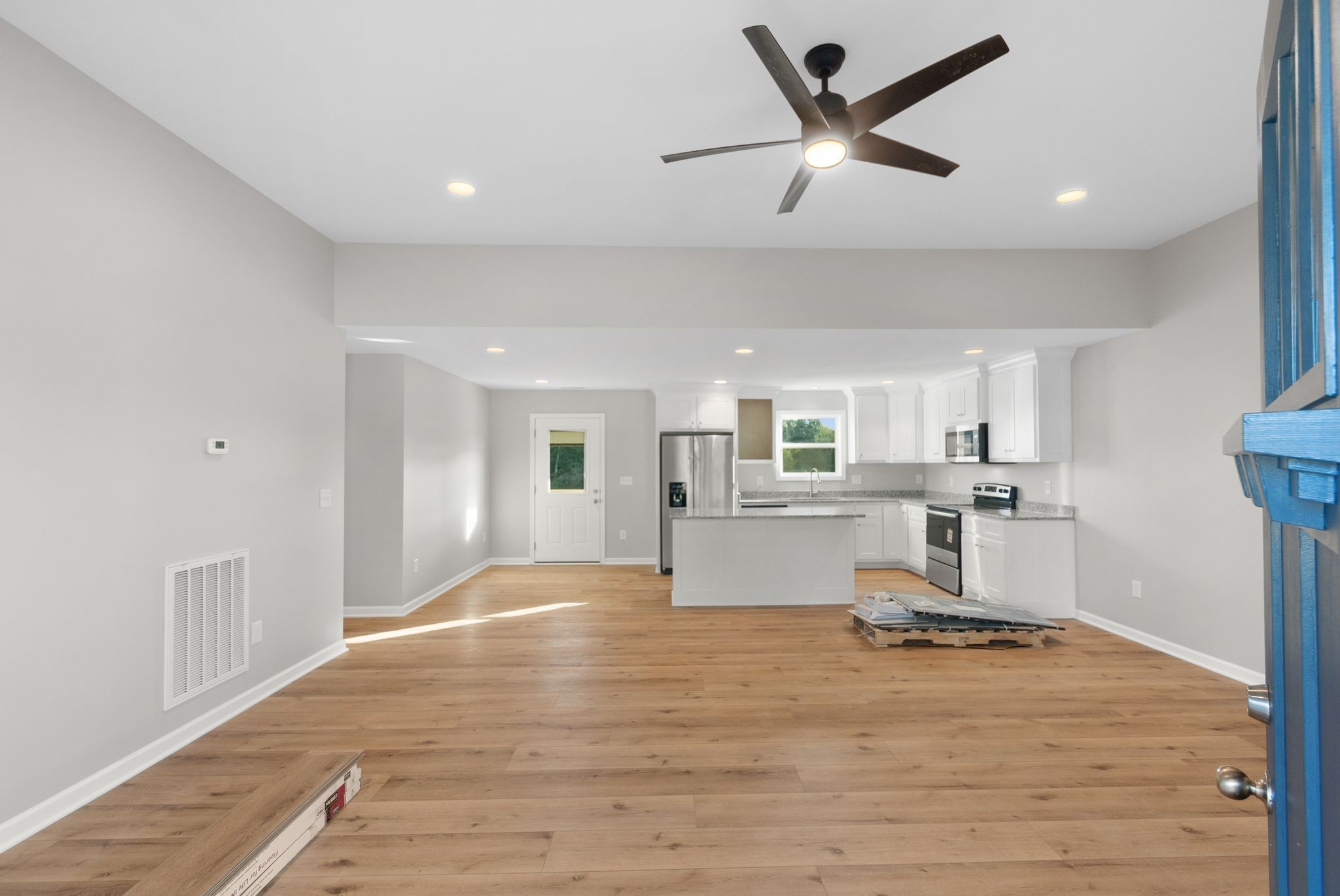 81 Dukes Park Road Summertown, TN 38483 - Photo 6 of 32 a living room with kitchen view and a wooden floor