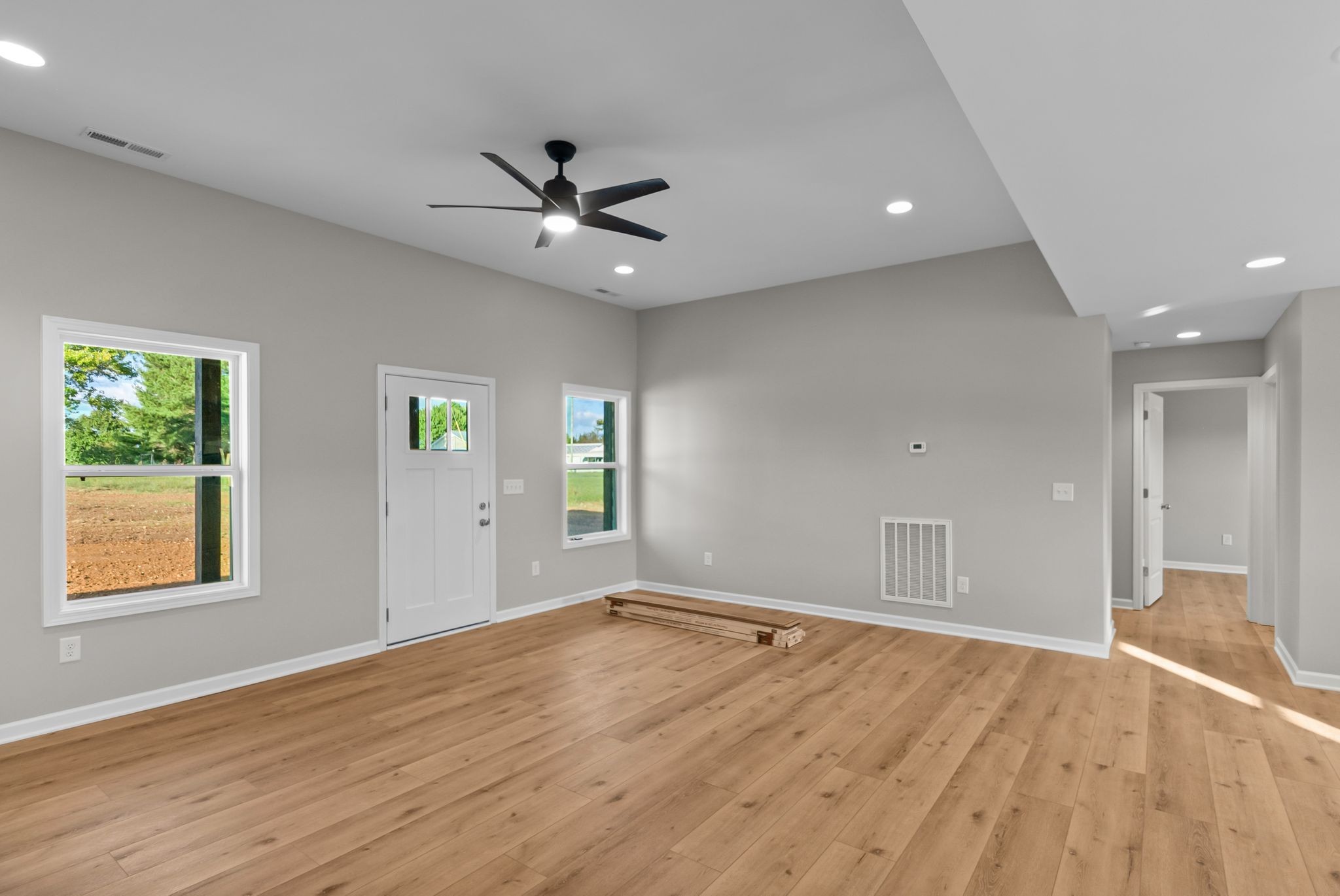 81 Dukes Park Road Summertown, TN 38483 - Photo 10 of 32 a view of an empty room with window and wooden floor