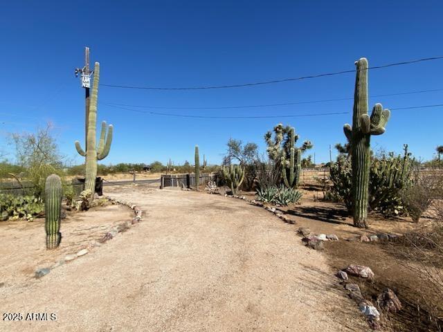 22695 East Cactus Forest Road Florence, AZ 85132 - Photo 3 of 45 a view of a ocean with a tree in the background